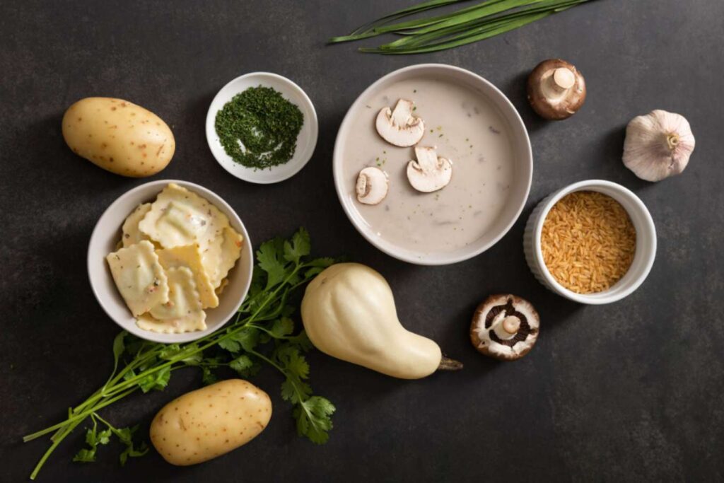 Ingredients for making miso soup, including tofu, seaweed, green onions, and miso paste, arranged on a dark surface.