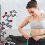 Smiling Woman Measuring Her Waist With A Tape Measure, Showcasing The Effectiveness Of Peptides For Weight Loss.