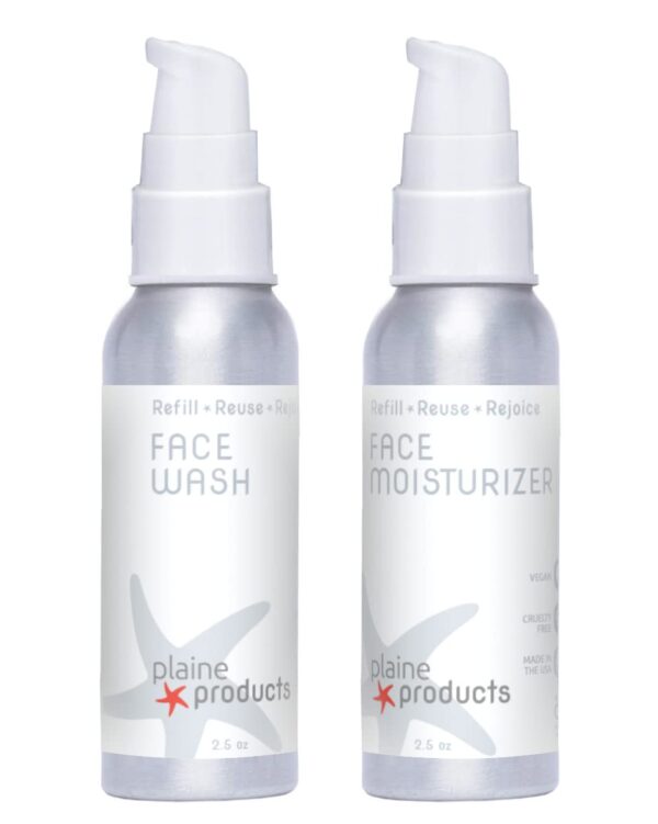 Two Aluminum Bottles Of Plaine Products Face Wash And Face Moisturizer With Pumps. Title: Plaine Products Face Wash And Moisturizer Bottles