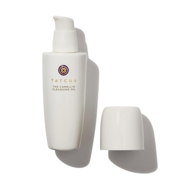 Tatcha Camellia Cleansing Oil Bottle With Its Cap Placed Beside It On A White Background.